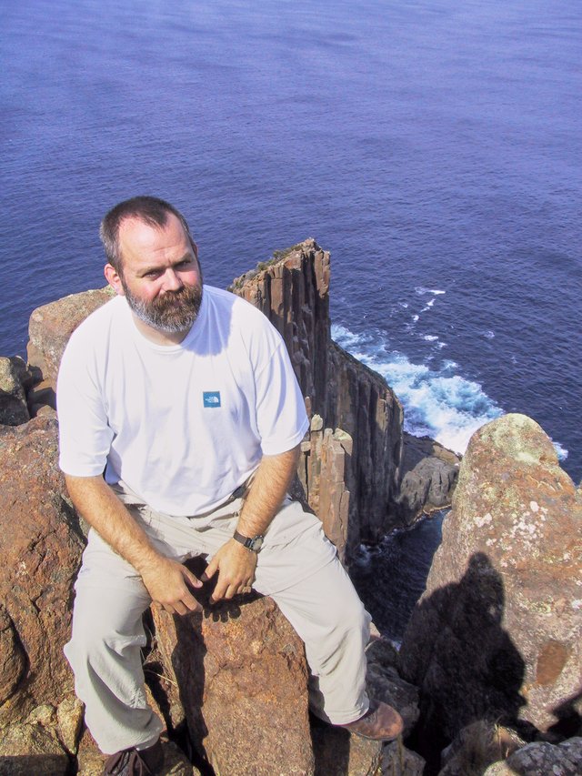 Me, Cape Raoul.  I really avoided looking down, because it was a good 200m drop off my left foot