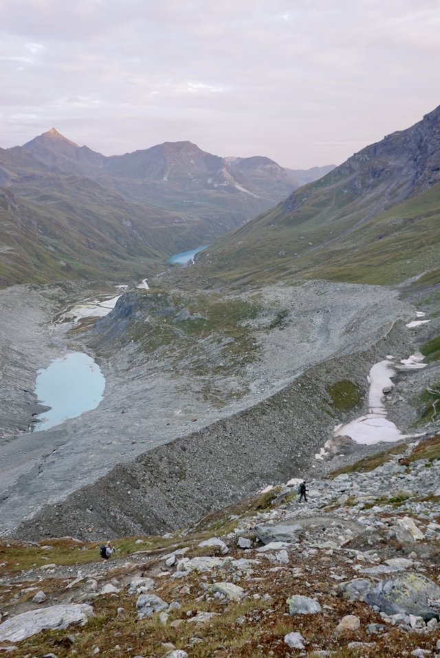 Down the sides of the retreating glacier