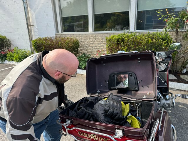 Damien and the vanity mirror on his vintage Gold Wing