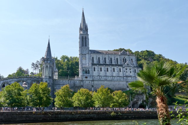 Basilica and grotto (to the left of the palm tree)